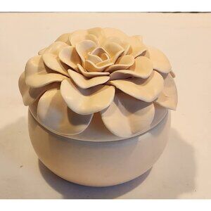 Illume Ceramic Flower Candle in a light pink/cream color, scent is Coconut Milk